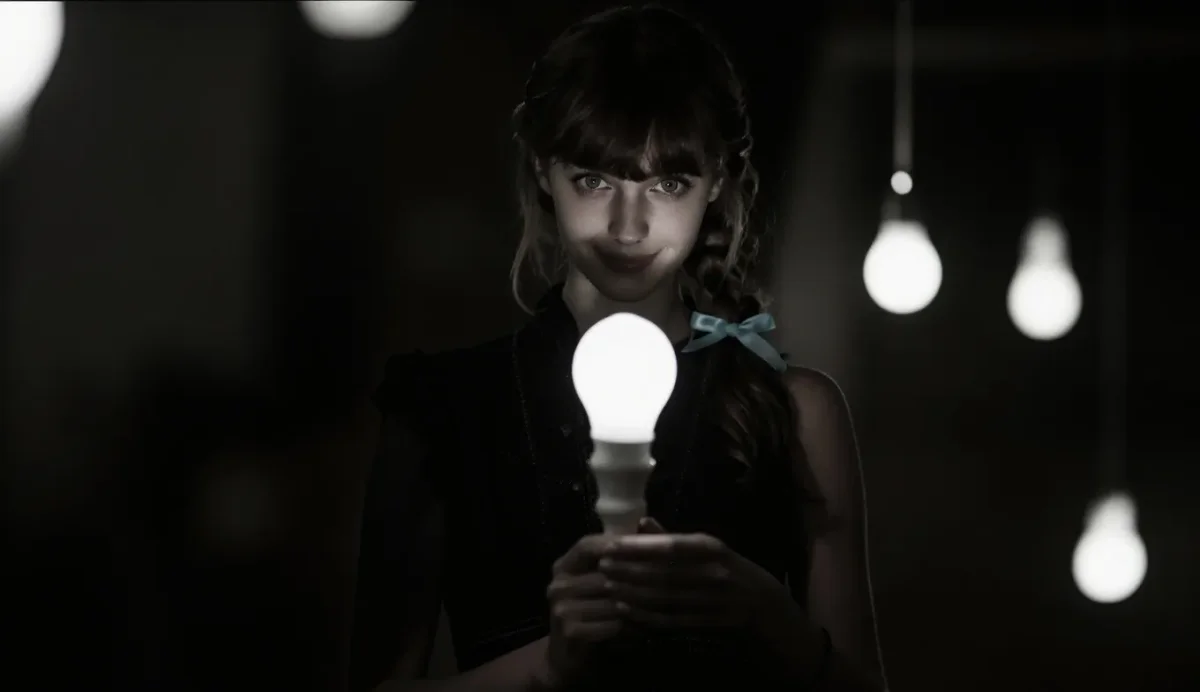 Portrait holding a glowing lightbulb — Portrait holding a glowing lightbulb. Natural photographic detail, balanced composition, expressive light and clear subject separation.…