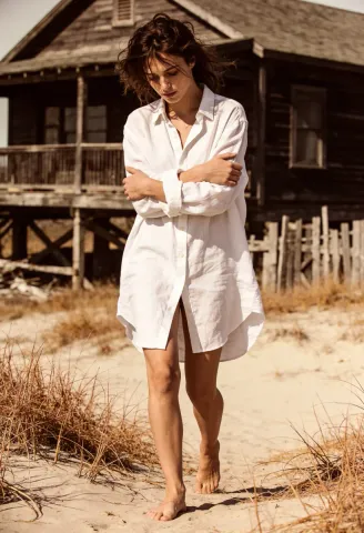 White linen beside a wooden cabin — White linen beside a wooden cabin. Natural photographic detail, balanced composition, expressive light and clear subject separation. Create a…