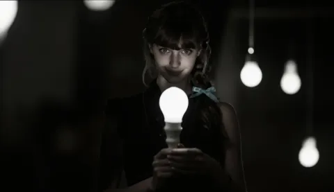 Portrait holding a glowing lightbulb — Portrait holding a glowing lightbulb. Natural photographic detail, balanced composition, expressive light and clear subject separation.…