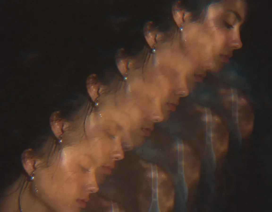 Echoes of a face — A warm portrait repeated through a prism into a diagonal series of soft reflections, experimental film texture.